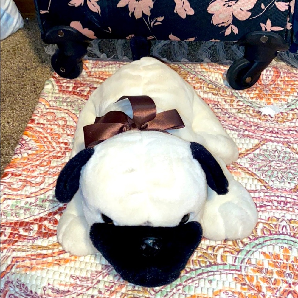 Dog plush with bow
